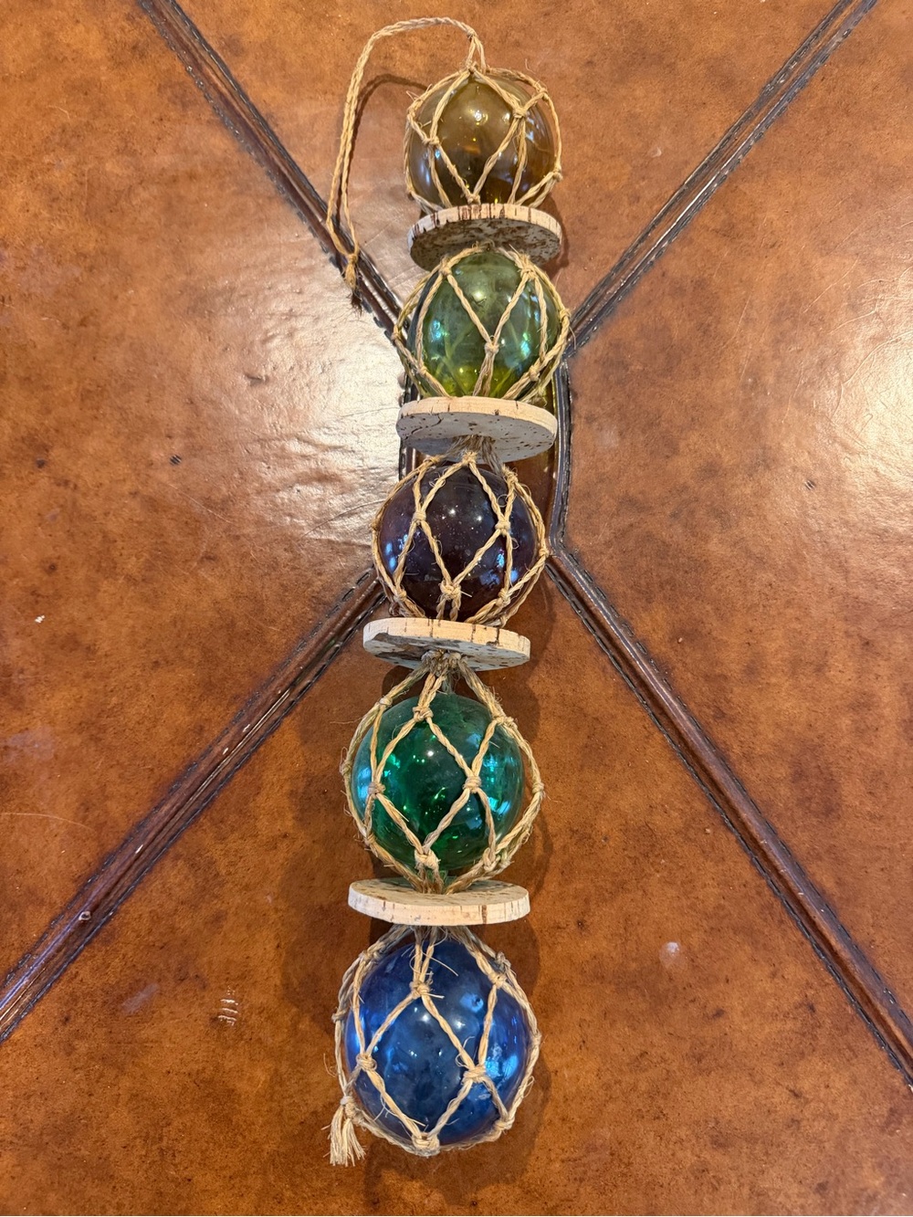 Vintage fisherman’s glass floats (4) round in netting